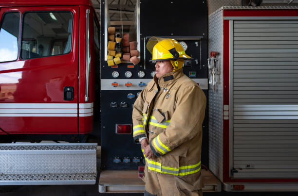 istock Firefighter on his 20s putting protection suit 1397140905