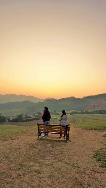 Tourists enjoying the Beautiful view of Wenlock Downs 9th Mile Shooting Point, Ooty during sunset. Must visit place in evening by tourists. Ooty,Tamilnadu,India-April 30 2022: Tourists enjoying the Beautiful view of Wenlock Downs 9th Mile Shooting Point, Ooty during sunset. Must visit place in evening by tourists. tamil nadu landscape stock pictures, royalty-free photos & images