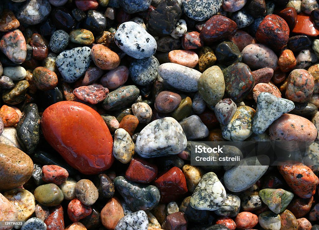 Stones at the beach Stones at the beach in Corsica - Porto Beach Stock Photo