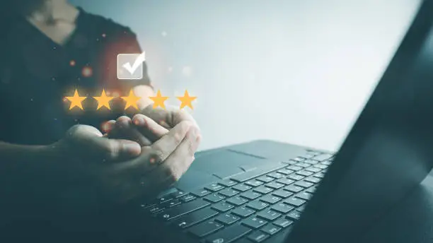 Photo of Customer satisfaction assessment rating 5 stars by laptop, User has received excellent service, Review the highest rated service, the best attention, impressed very good service, feedback from guest.
