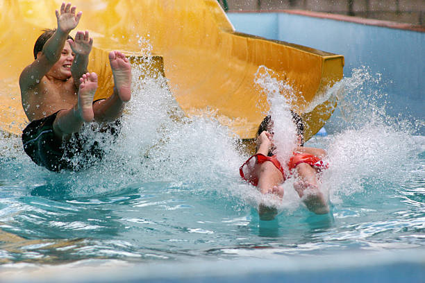 Children, water slide splash stock photo