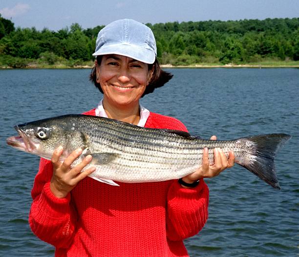 feliz angler - fisherwoman fotografías e imágenes de stock