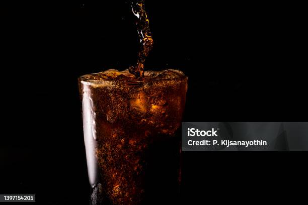 Closeup Iced Cola Isolated In The Black Background Stock Photo - Download Image Now