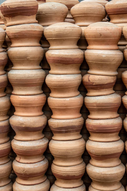 istock Terracotta pots stacked to dry before cooking. 1397155188