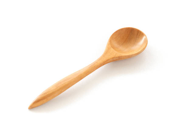 istock A wooden spoon is placed on a white ceramic background. Concept of isolated objects on a white background. Shot in natural light. 1397155362