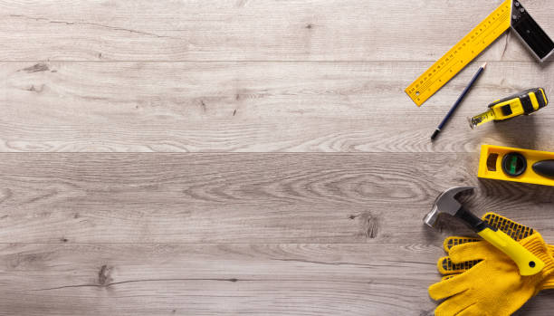 istock Wood laminate and tools on floor background texture. Wooden laminate top view 1397156872