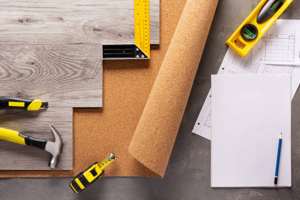 istock Wood laminate and tools on floor background texture. Wooden laminate top view 1397156934