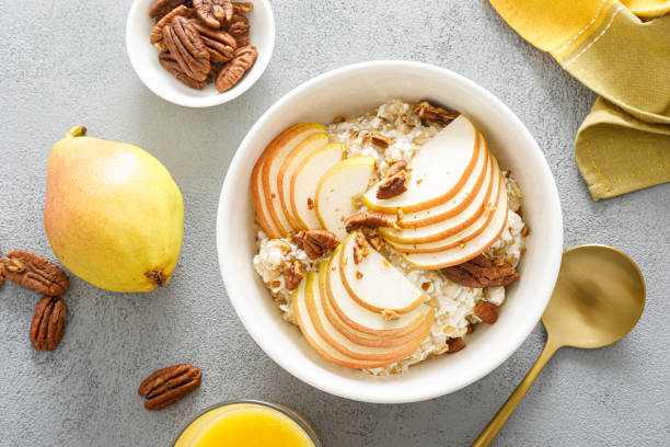istock Oatmeal with cottage cheese, pecan nuts and pear for breakfast 1397159905