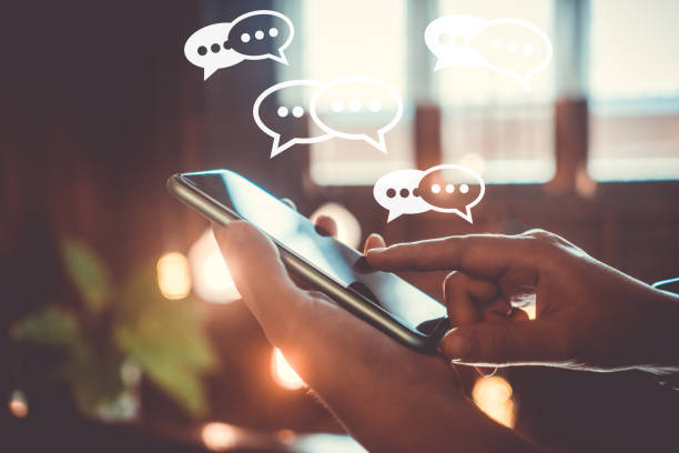 istock People hand using smartphone typing, chatting or text  messages in chat icons pop up. Social media maketing technology concept. 1397162075