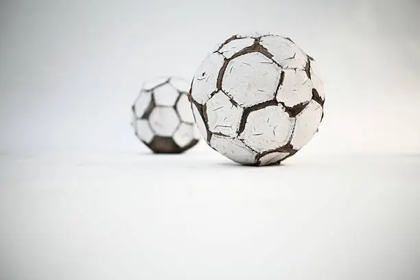 two old footballs