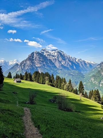 View on Corvara Rabenstein village along the Timmelsjocher Strasse with the Sacred Heart of Jesus Church Kirche und Friedhof Rabenstein in South Tyrol in the Italian Alps during a springtime evening.