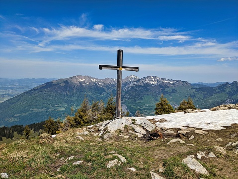 ;ountain Nuenchamm. Summit cross on the mountain in Glarus above Netstal and Walensee. Beautiful landscape panorama