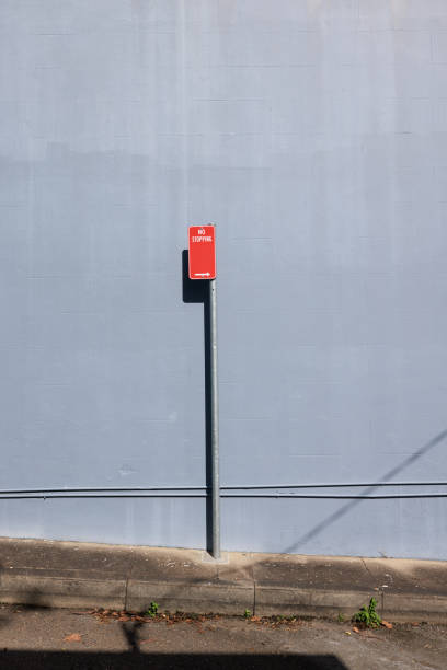 istock Red No stopping sign on a metal pole 1397166056