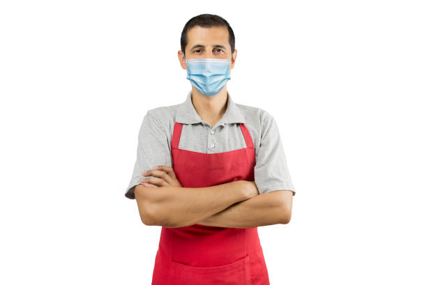 istock Business owner in red apron with surgical mask 1397169279