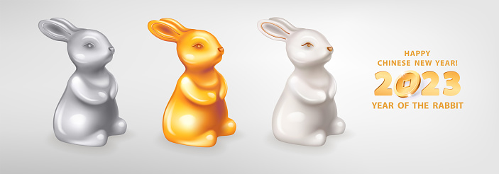 Set of three figurines of cute Rabbits different colors. White ceramic, silver and golden metal. Rabbit is a symbol of the 2023 Chinese New Year. Vector illustration of decorative zodiac sign of rabbit