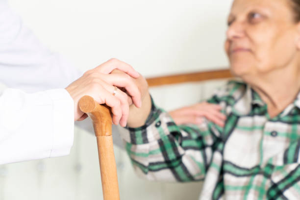 istock Caring nurse talks with her elderly patient 1397169562