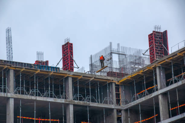 istock A worker prepares formwork for a modern metal-concrete structure of a residential building. 1397169655