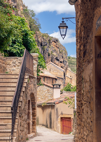 istock Medieval narrow street in a unique Peyre town. Aveyron, Occitania, Southern France (vertical photo) 1397170620