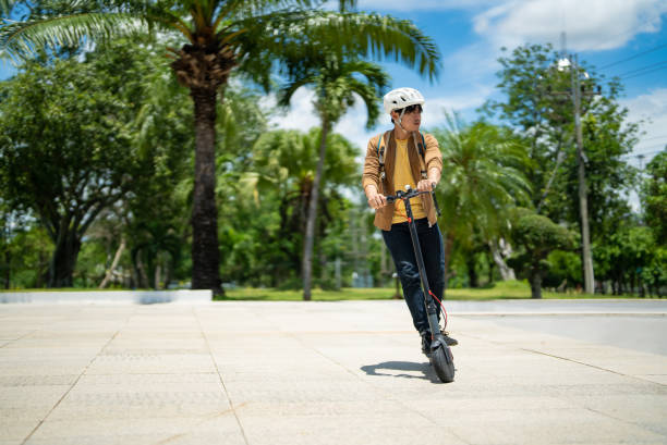 istock An Asian man rides an electric scooter to work. 1397171106