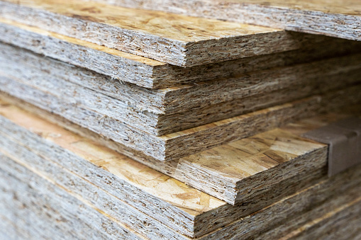 a stack of chipboard in a hardware store. wooden usb sheet. Sale of wooden building materials, repair
