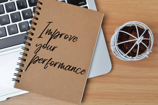istock Top view of notebook written with text IMPROVE YOUR PERFORMANCE 1397175530