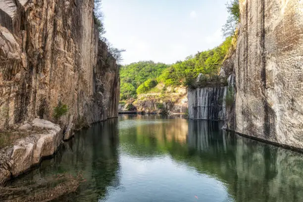 A small lake in Pocheon art valley. An old granite quarry turned into park with famous granite cliffs reflecting on the lake.
