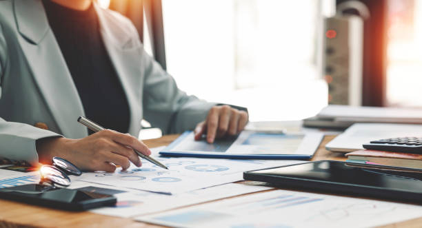 istock Businesswoman working at office with documents on her desk, doing planning analyzing the financial report, business plan investment, finance analysis concept. 1397176598