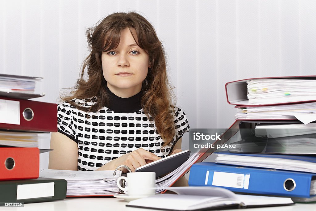Tired woman - economist Tired woman - an economist on the workplace Adult Stock Photo