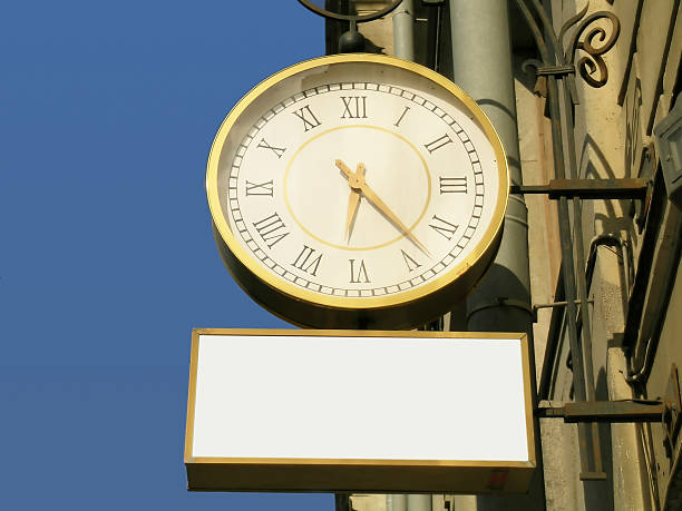 Street clock with the blank advertisement place stock photo