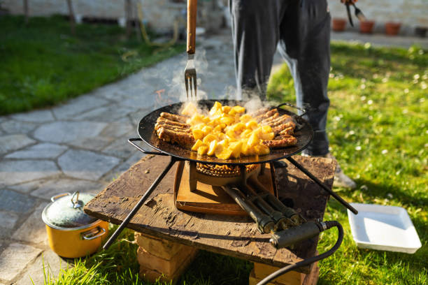 istock Unrecognizable man making potatoes and kebabs on hot iron plate 1397177688