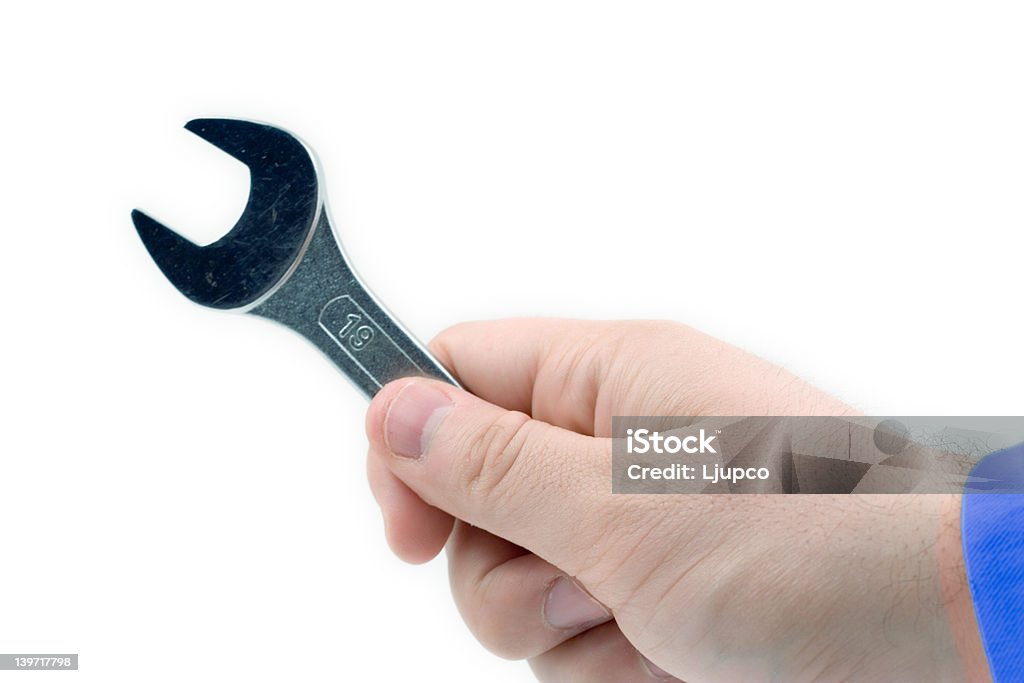Mano agarrando una llave - Foto de stock de Acero libre de derechos