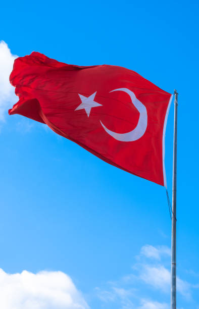 istock Turkish flag waving in the blue sky. Flagpole. 1397178458