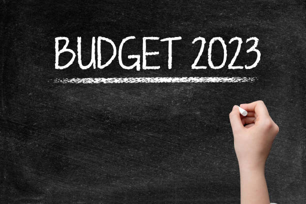 istock Budget 2023 on blackboard with woman hand 1397180739