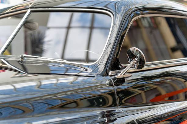 istock Black and glossy retro car, close-up. side view 1397180783