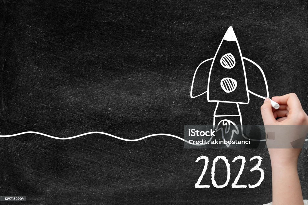 2023 Creative idea concept with rocket on blackboard 2023 Rocket drawing for creative idea concept, computer graphic with chalk drawings blackboard. 2023 Stock Photo