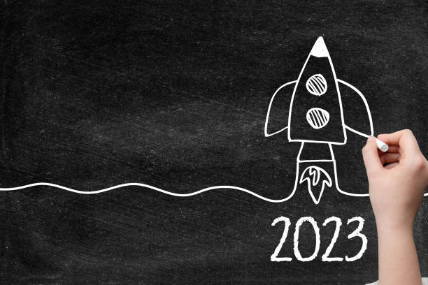 2023 Creative idea concept with rocket on blackboard stock photo