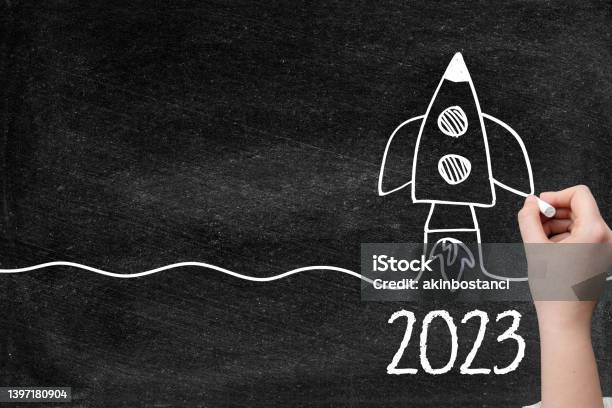 2023 Creative Idea Concept With Rocket On Blackboard Stock Photo - Download Image Now