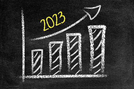 2023 new year, ascending arrow, blackboard, bar graph