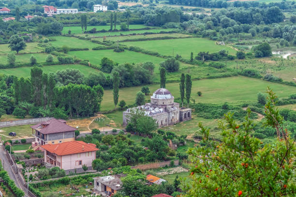 Top view of Lead Mosque among the fields near Shkoder in Albania. Beautiful landscape with old Albanian architecture among nature
