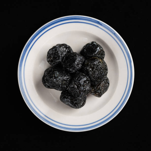 istock Chinese Smoked Plum on Black Background 1397187434