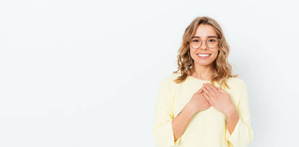 istock Friendly peaceful young blonde woman holding hands 1397187847