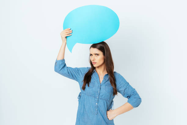 istock Angry dissatisfied young woman with blank speech bubble 1397187883