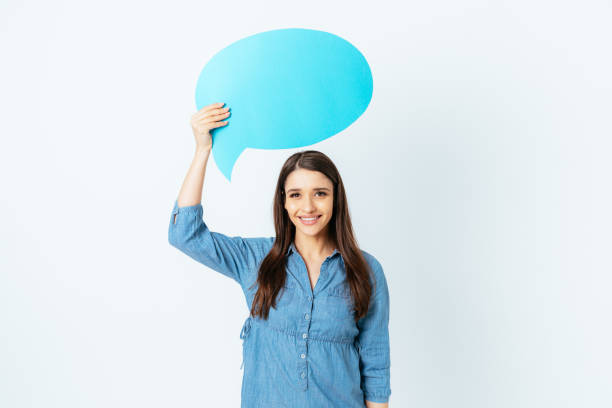 istock Cute smiling young woman holding above her head 1397187912