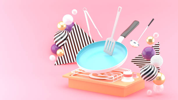 The pan is cooking, surrounded by colorful balls on a pink background.-3d rendering."n stock photo