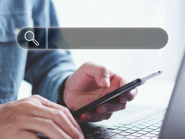 istock Search Engine Optimization, searching information online, Businessman use cell phone to search data on internet finding information Website online. Concept of SEO, Mobile, Smartphone, Technology 1397189996
