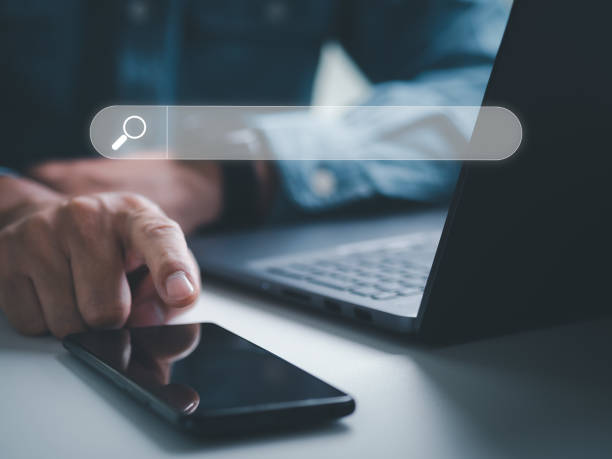 istock Search Engine Optimization, searching information online, Businessman use cell phone to search data on internet finding information Website online. Concept of SEO, Mobile, Smartphone, Technology 1397190013