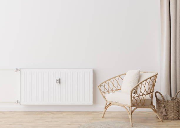istock White heating radiator with thermostat on white wall in modern room. Central heating system. Free, copy space for your text. 3D rendering. 1397190654