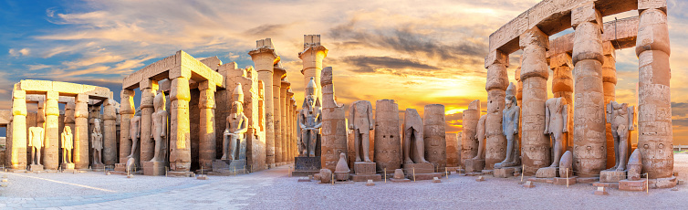 Luxor Temple courtyard and the statues of Ramses II, Second Pylon, Egypt.