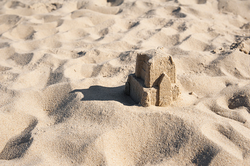 Closeup of the little sandcastle on the beach