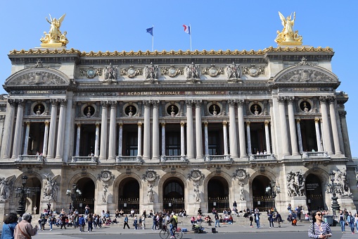 After 2 years of Covid 19 , with a beautiful weather, on April 29th 2022, tourists visit the opera Garnier in Paris